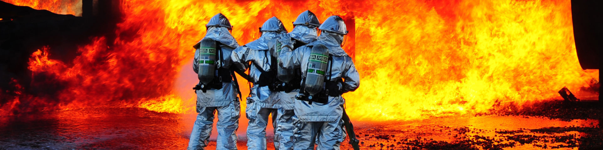 Dyess and Abilene Regional airport firefighters team up to extinguish an aircraft fire during a joint training exercise here Nov 5. Firefighters from ABI are required by the Federal Aviation Association to be proficient in extinguishing aircraft fires. By inviting them onto the base, Dyess firefighters facilitate a means to achieve their annual training and foster a working  relationship. (U.S. Air Force Photo/Airman 1st Class Chelsea Cummings)